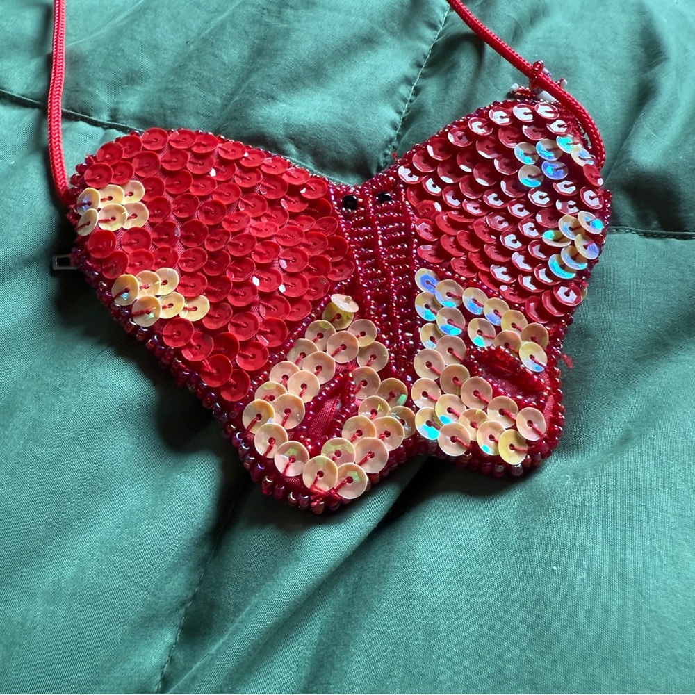 Red sequin beaded coin or small purse with zipper opening and rope strap
